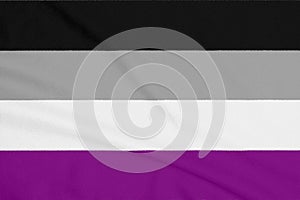 LGBT asexual community flag on a textured fabric. Pride symbol