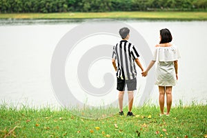 lgbt asian women holding hand