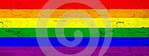 LGBT Background - Brick wall painted with rainbow flag - wood texture