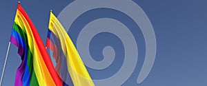 LGBT and Colombian flags on flagpole on blue background on side. Rainbow flag. Place for text. Bogota. LGBT community. 3d