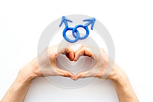 LGBT concept. Male Mars symbol in hands on white background top-down