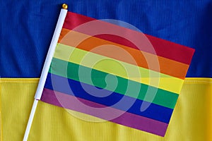 LGBT flag against the background the flag of Ukraine. LGBT Pride Month. LGBTQIA