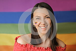 LGBT flag behind the person. The concept of equality and support of diversities to people photo