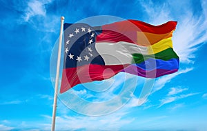 LGBT flag of the Confederate States of America 1861-1863 state, USA at cloudy sky background on sunset, panoramic view. copy space