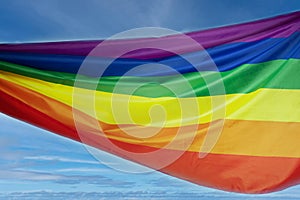 Lgbt flag on sky background, pride,solidarity with homosexuals,support for transgender rights concept