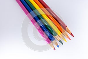 LGBT and Gay Pride rainbow colored pencils against a white background. Equality and Diversity concept - image