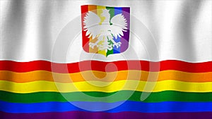 LGBT Gay Pride rainbow flag of Poland with coat of arms waving in the wind. Symbol of tolerance and discrimination in Poland