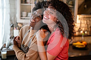 LGBT Lesbian couple love happiness concept. Homosexual women hugging and enjoying time together.