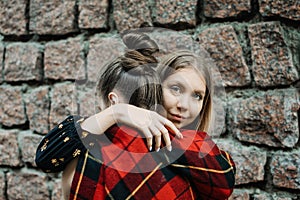 LGBT Lesbian couple love moments concept. Two Young lesbians girls hugging and walking outdoors. Happy girlfriends in