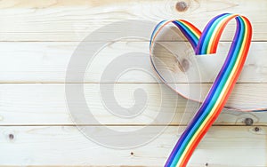 LGBT, LGBTQ for gay pride month and International Day Against Homophobia, Transphobia and Biphobia with rainbow ribbon flag