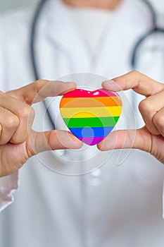 LGBT pride month or LGBTQ+ or LGBTQIA+ and health concept. Doctor with rainbow and colorful heart shape with for Lesbian, Gay,