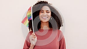Lgbt, rainbow and black woman with a flag for support to the gay, lgbtq, queer and lesbian community. Portrait of happy