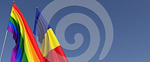 LGBT and Romanian flags on flagpole on blue background on side. Rainbow flag. Place for text. Bucharest. LGBT community. 3d