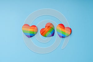 LGBTQ flag and symbol on table top view