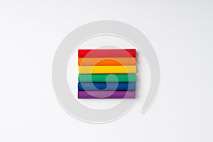 LGBTQ flag and symbol on table top view