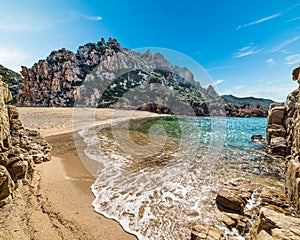 Li Cossi beach under a blue sky