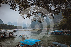 Li River Lijiang River. Pleasure boats at the pier in Xingping