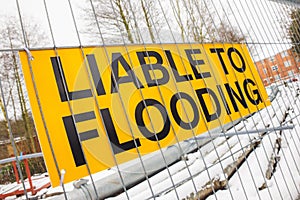 Liable to Flooding warning sign on yellow background