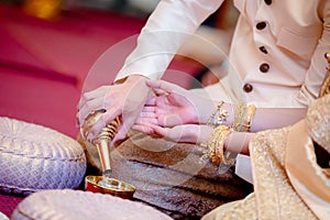 Libation, Thai engagement, pour water in Thai wedding, pouring water in Thai wedding