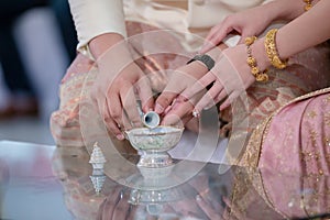 libation, Thai engagement, pour water in Thai wedding, pouring water in Thai wedding