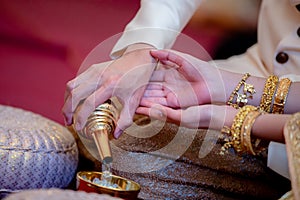Libation, Thai engagement, pour water in Thai wedding, pouring water in Thai wedding