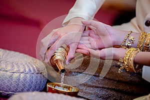 Libation, Thai engagement, pour water in Thai wedding, pouring water in Thai wedding