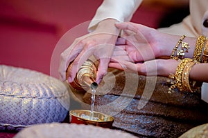 libation, Thai engagement, pour water in Thai wedding, pouring water in Thai wedding photo