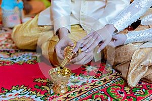 libation, Thai engagement, pour water in Thai wedding, pouring water in Thai wedding. photo