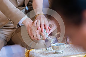Libation, Thai engagement, pour water in Thai wedding, pouring water in Thai wedding. photo