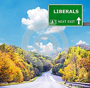 LIBERALS road sign against clear blue sky