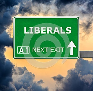 LIBERALS road sign against clear blue sky