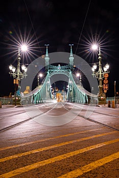 Liberty Bridge in Budapest in the evening time, with starry Liberty Bridge in Budapest in the evening time, with starry traffic