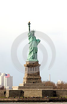 Liberty Island with crowds dwarfed by the Statue of Liberty