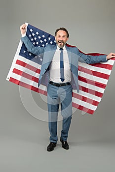 Liberty and justice for all. Patriotic businessman hold american flag. Happy man celebrate Independence day. American