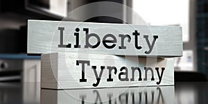 Liberty, tyranny - words on wooden blocks