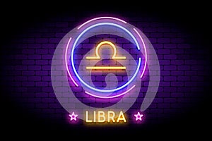 The Libra zodiac symbol in neon style on a wall.