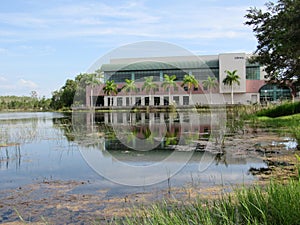 Library building reflecting across a lake