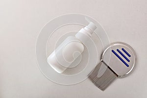 Lice treatment concept with comb and bottle with liquid eliminator