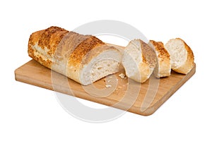 Liced wheat bread on wooding cutting board