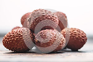 Lichee on wooden table, litchi, lychee fruit detail photo