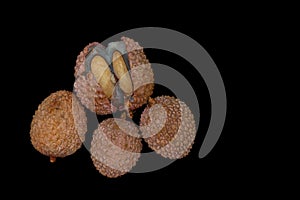 Lichi fruit with fresh juice on black table