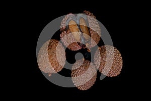 Lichi fruit with fresh juice on black table