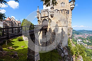 Lichtenstein Castle with vintage bridge at mountain top, Germany, Europe