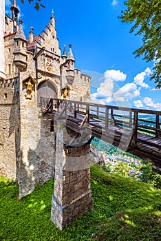 Lichtenstein Castle with wooden bridge, Baden-Wurttemberg, Germany. This fairy tale castle is a landmark of Swabia photo