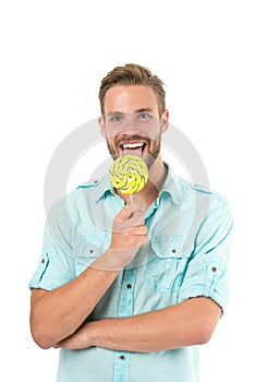 Lick it. Man handsome bearded guy smiling while licking candy. Guy cheerful smile macho feels happy and satisfied