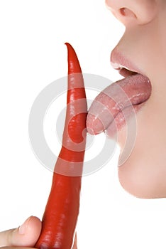 Licking chili pepper