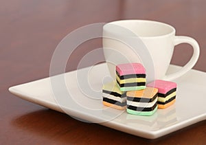 Licorice allsorts on a white plate