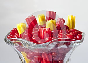 Licorice in a clas jar red and yellow photo
