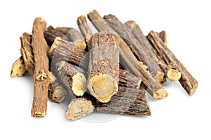 Licorice or liquorice root sticks isolated on white background photo