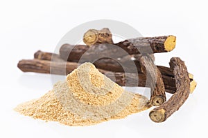 Licorice powder and roots - Glycyrrhiza glabra - White background photo